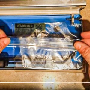 a hand removing seal from ziplock